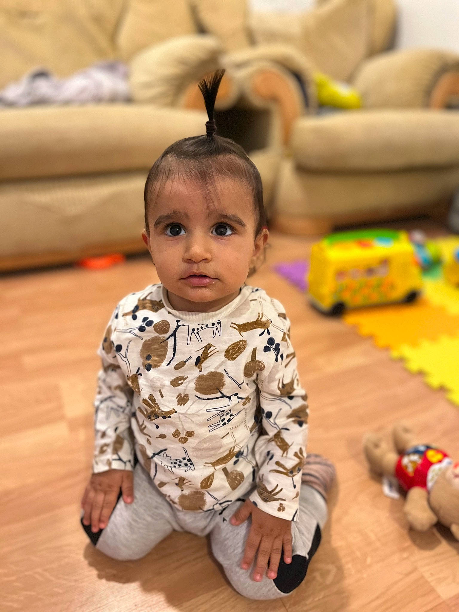 Patrick is registered to the contest to win money with this photo: baby, baby_toddler_clothing, child, comfort, couch, facial_expression, floor, flooring, fun, happy, hardwood, head, person, product, skin, sleeve, smile, textile, toddler, toy