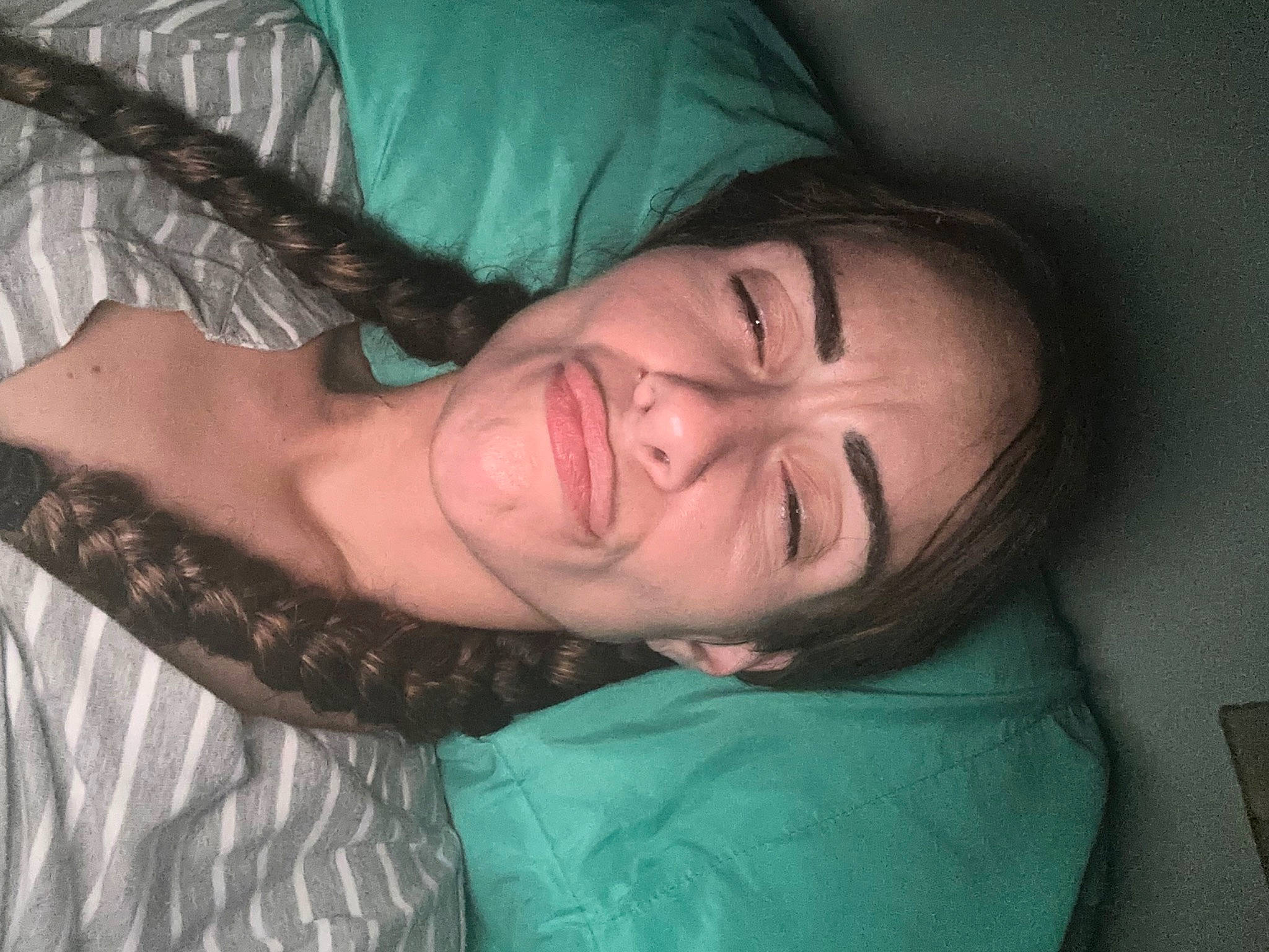 Abriella is registered to the contest to win money with this photo: abdomen, black_hair, chest, comfort, elbow, eyebrow, flesh, fun, happy, human_leg, jaw, linens, mouth, nap, neck, nose, pattern, person, sitting, skin