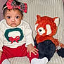 baby, child, plush_toy, red_panda, sweater, headband, bow, sitting, cozy, chair, indoor, cute, wide_eyes, sock, knitwear, holiday, soft_toy, person, portrait, expression