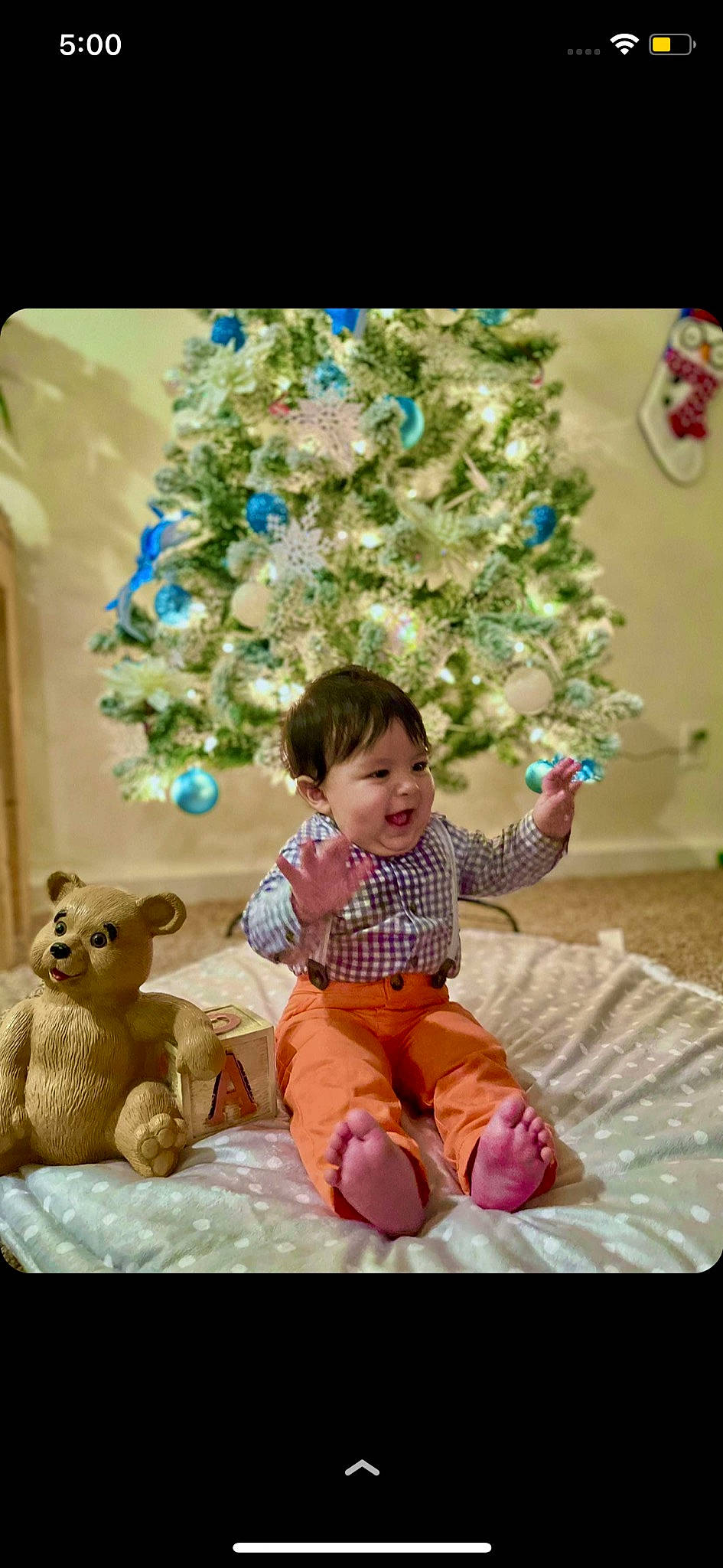 Miguel joined the competition — help win amazing prizes! baby, baby_toddler_clothing, child, christmas, christmas_decoration, christmas_ornament, christmas_tree, event, face, fun, happy, holiday, holiday_ornament, ornament, person, photograph, smile, snapshot, toddler, toy