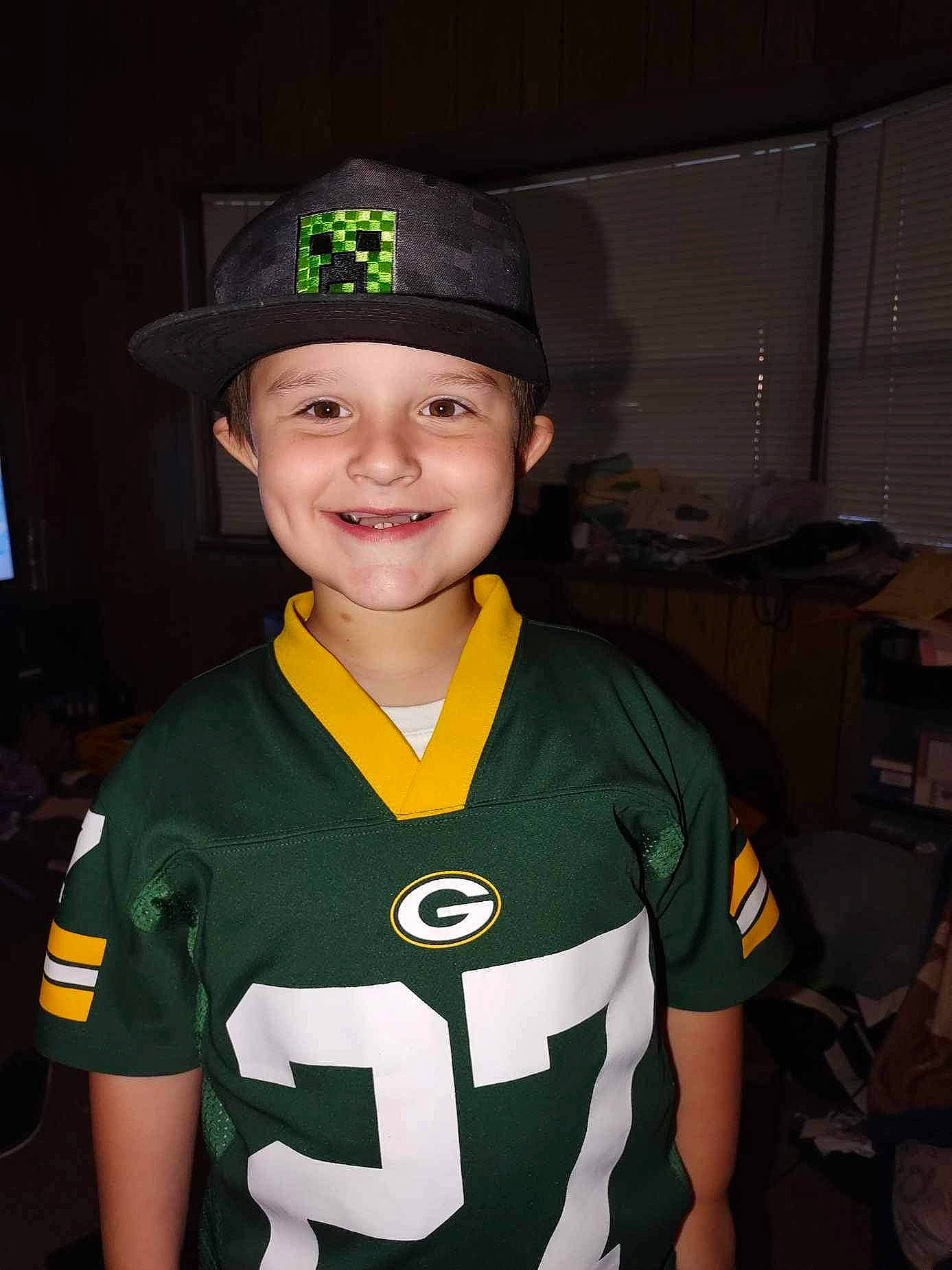 Thomas is registered to the contest to win money with this photo: cap, costume, costume_hat, electric_blue, fictional_character, flash_photography, hat, headgear, headwear, jersey, joy, person, personal_protective_equipment, player, sleeve, smile, sports_gear, sports_jersey, sports_uniform, sportswear