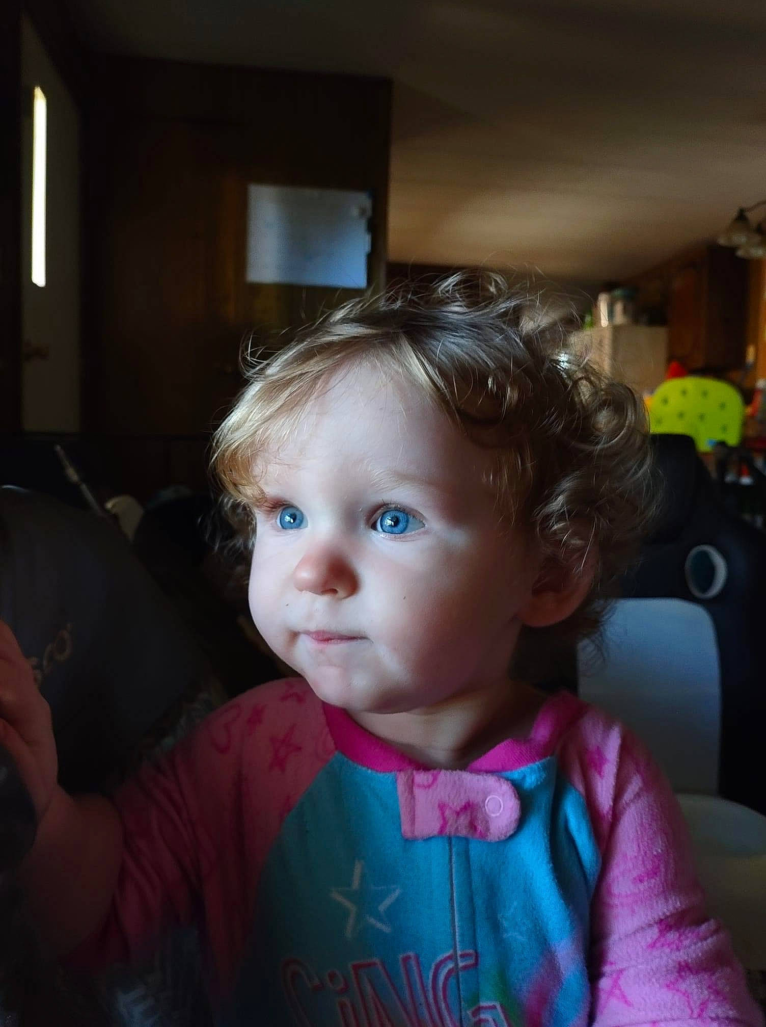 Isabella is registered to the contest to win money with this photo: baby, baby_toddler_clothing, chair, cheek, child, ear, eyelash, facial_expression, flooring, fun, happy, iris, magenta, person, room, sitting, skin, sleeve, smile, toddler