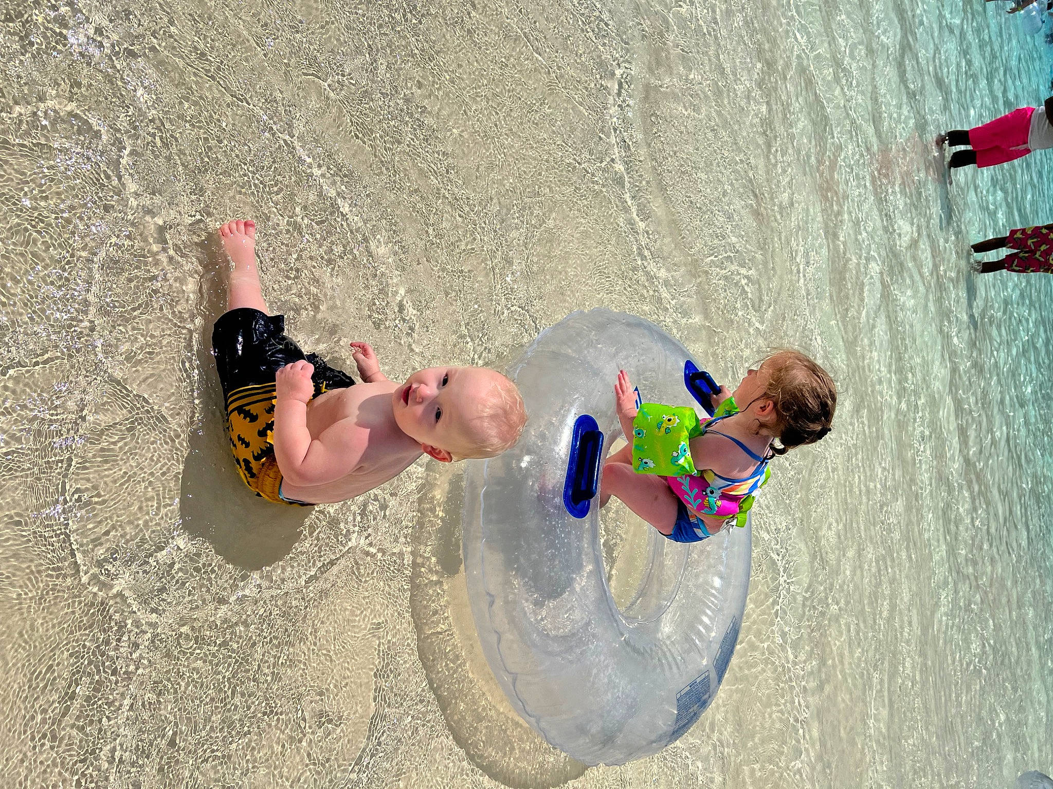 Lance is registered to the contest to win money with this photo: beach, body_of_water, child, coast, fun, happy, landscape, leisure, people_in_nature, people_on_beach, person, play, recreation, sand, shadow, sun_tanning, toddler, vacation, water, wave