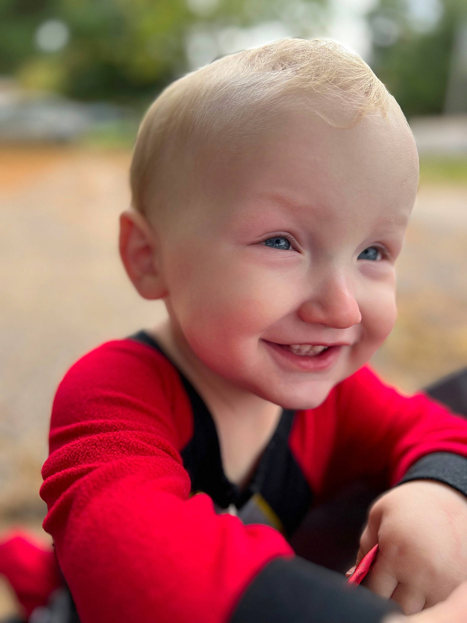 Lance is registered to the contest to win money with this photo: arm, baby, baby_toddler_clothing, cheek, chin, flash_photography, grass, happy, human_body, iris, joy, leisure, lip, nose, people_in_nature, person, plant, skin, smile, toddler