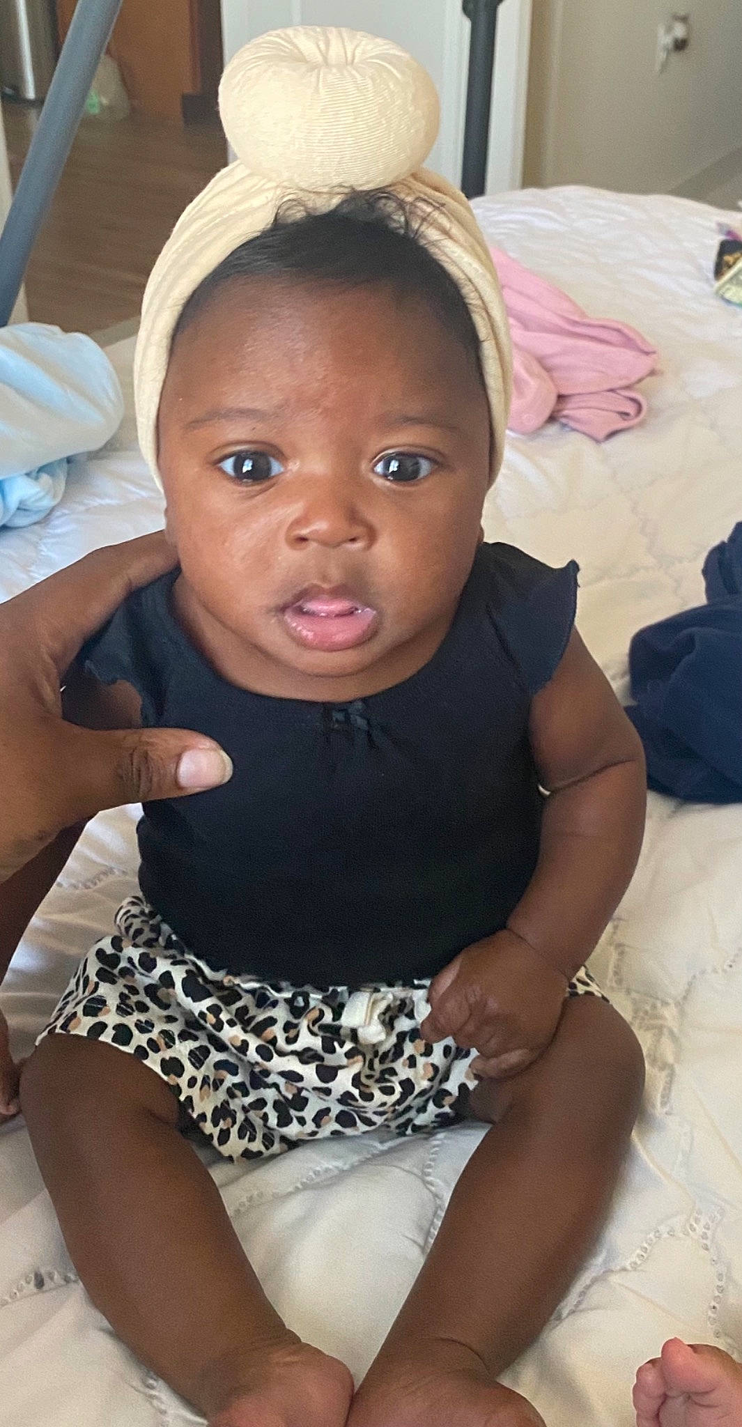 Brooklyn is registered to the contest to win money with this photo: baby_toddler_clothing, black, cheek, eye, eyelash, face, facial_expression, hairstyle, head, human_body, iris, leg, lip, mouth, neck, organ, person, skin, sleeve, textile