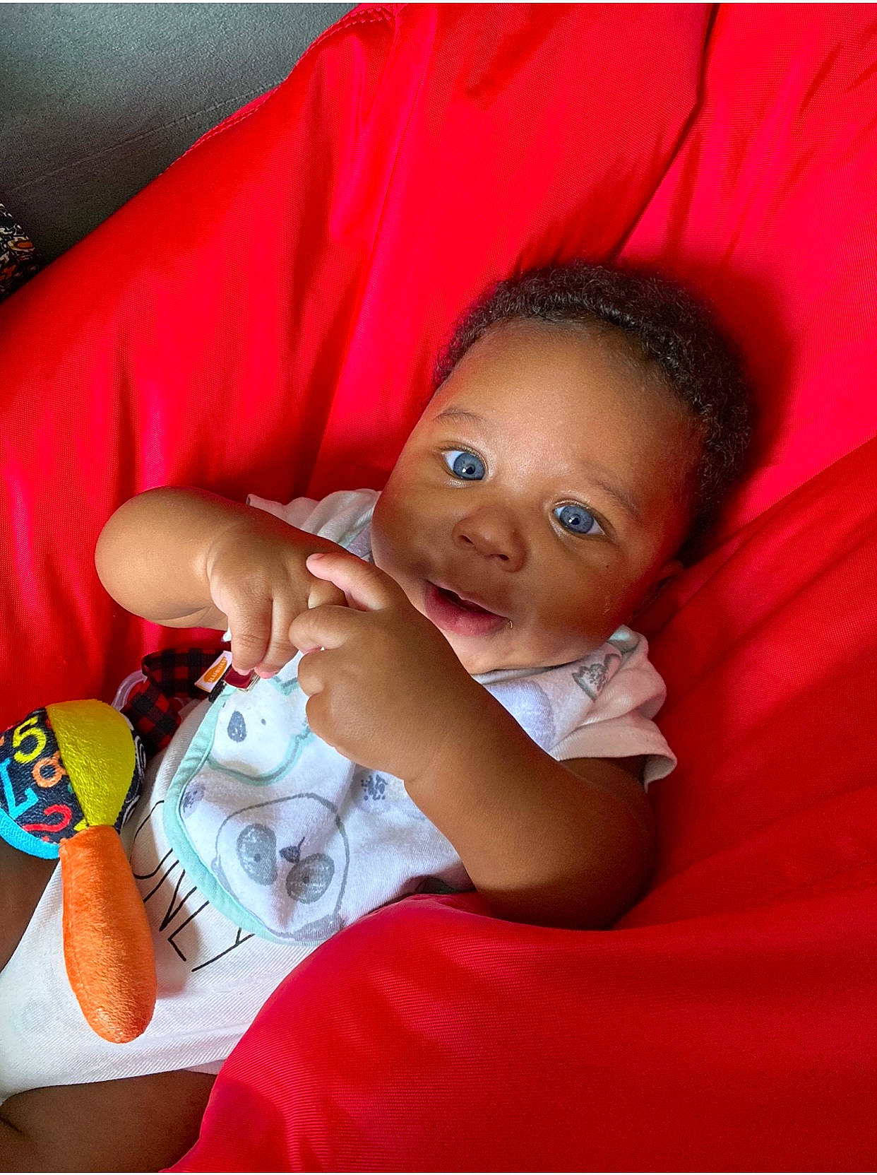 Braylen is registered to the contest to win money with this photo: baby, baby_toddler_clothing, cheek, child, comfort, doll, finger, fun, gesture, happy, magenta, nail, person, pink, play, skin, smile, textile, thumb, toddler