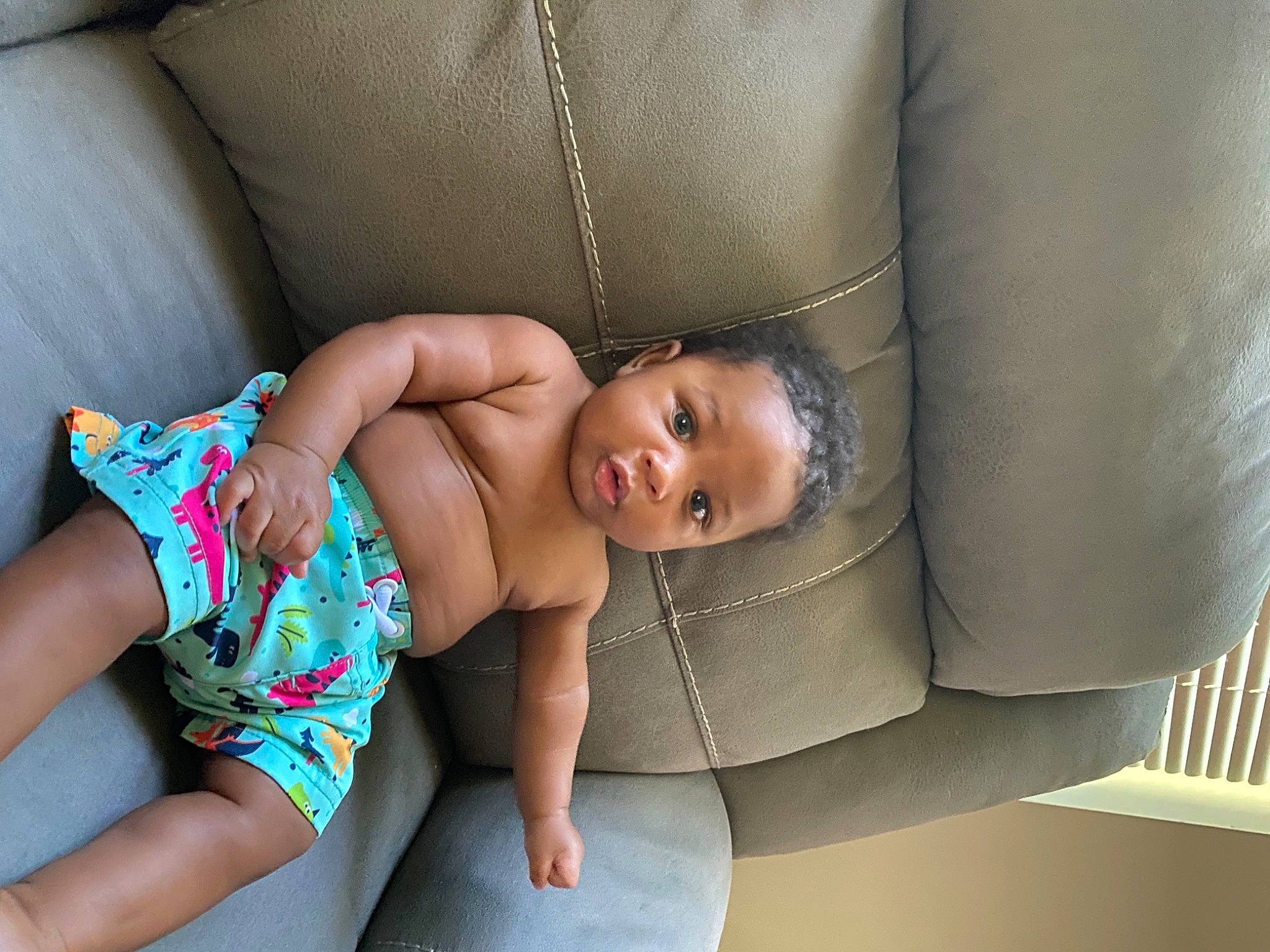 Braylen is registered to the contest to win money with this photo: baby, baby_toddler_clothing, chest, comfort, couch, eye, face, finger, glasses, hair, hand, head, human_body, joint, knee, leg, neck, person, skin, thigh