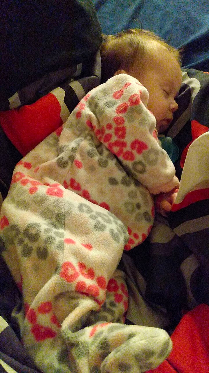 Vanessa is registered to the contest to win money with this photo: baby, baby_sleeping, baby_toddler_clothing, bedding, bedtime, blanket, carmine, child, comfort, happy, linens, nap, pattern, person, room, sitting, skin, sleep, sleeve, textile