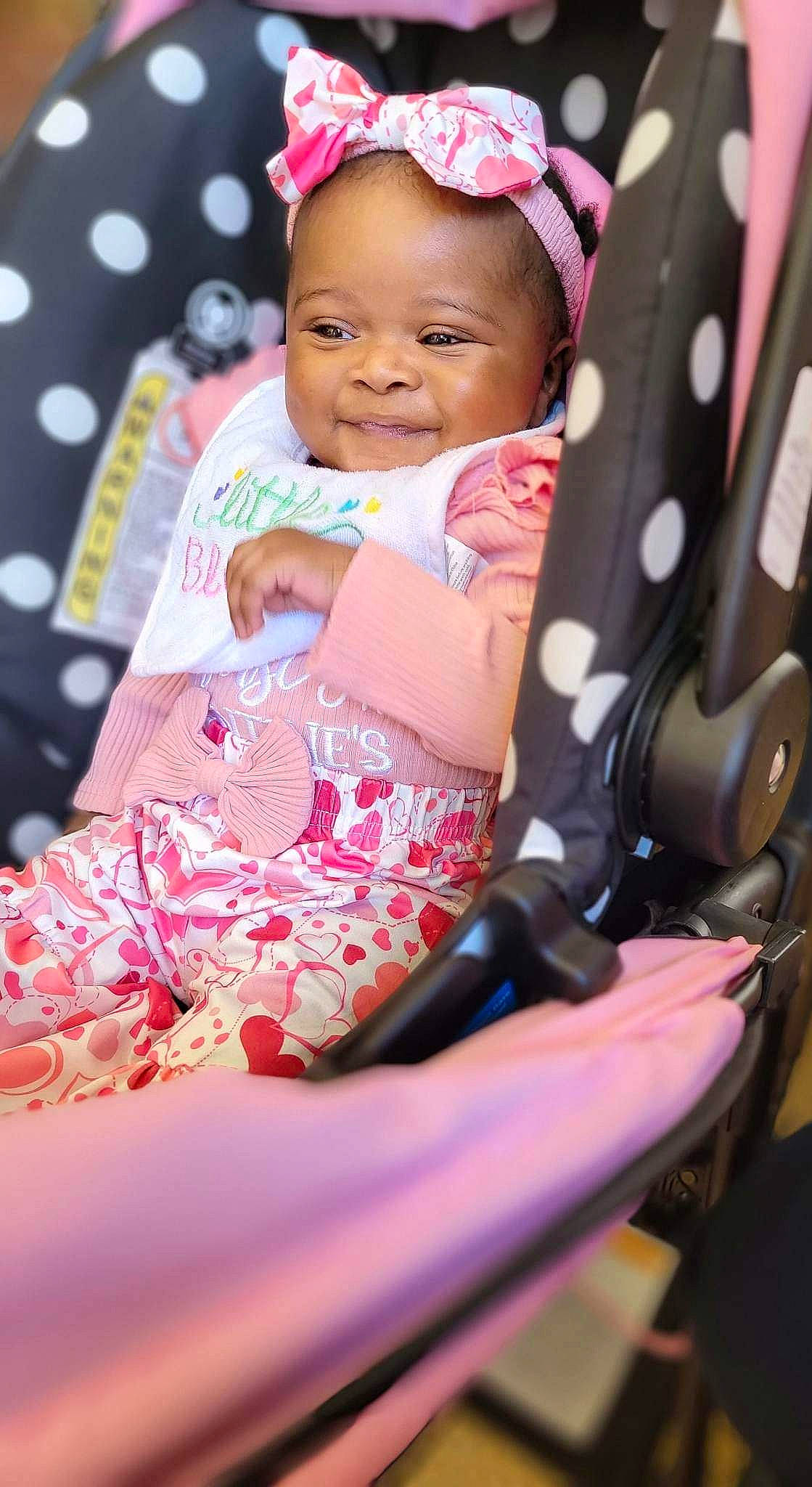 Hallie joined the competition — help win amazing prizes! baby, baby_carriage, baby_products, baby_toddler_clothing, child, event, eye, face, fashion_accessory, fun, happy, joy, leisure, magenta, pattern, person, pink, purple, sitting, smile