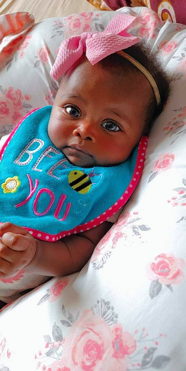 Hallie is registered to the contest to win money with this photo: baby, baby_products, baby_toddler_clothing, cap, cheek, child, chin, dress, eyelash, fashion_accessory, happy, hat, head, headgear, lip, magenta, person, pink, skin, sleeve