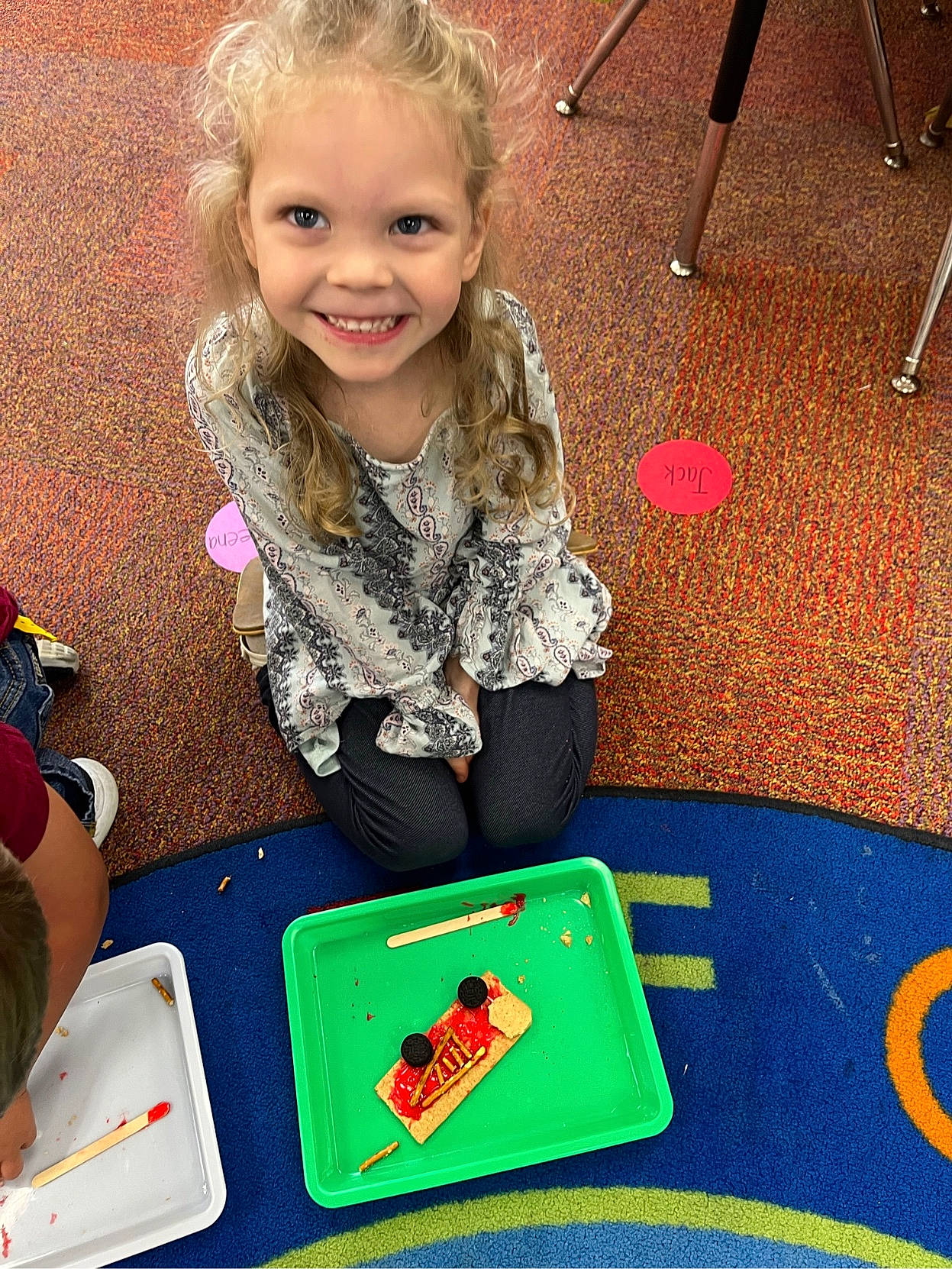 Daveena is registered to the contest to win money with this photo: chair, child, comfort_food, flooring, fun, games, happy, indoor_games_and_sports, joy, leisure, pattern, person, play, recreation, sharing, sitting, smile, toddler, visual_arts