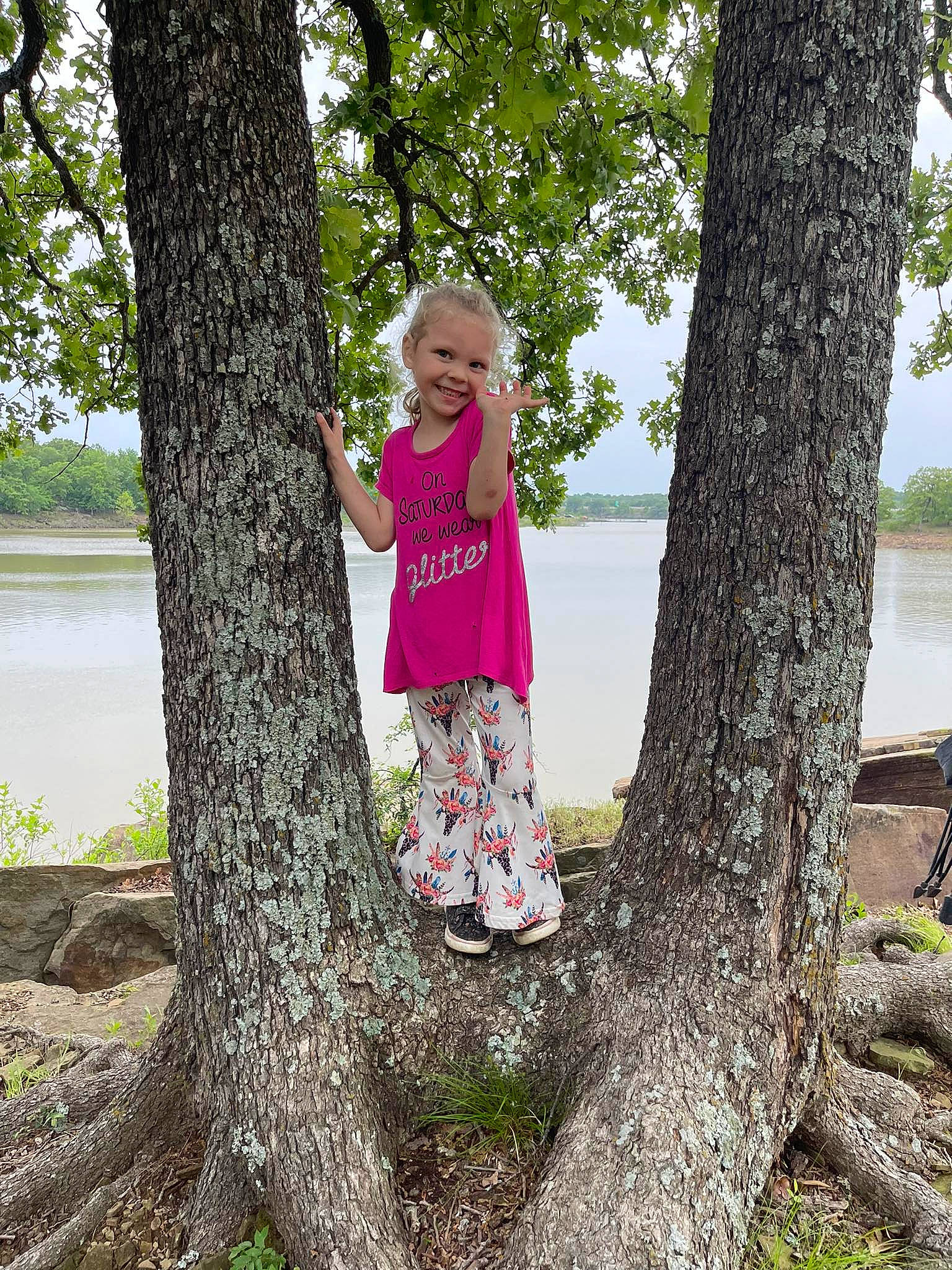 Daveena joined the competition — help win amazing prizes! branch, child, fun, grass, happy, joy, lake, leisure, people_in_nature, person, plant, recreation, sky, smile, toddler, tree, trunk, waist, water, wood