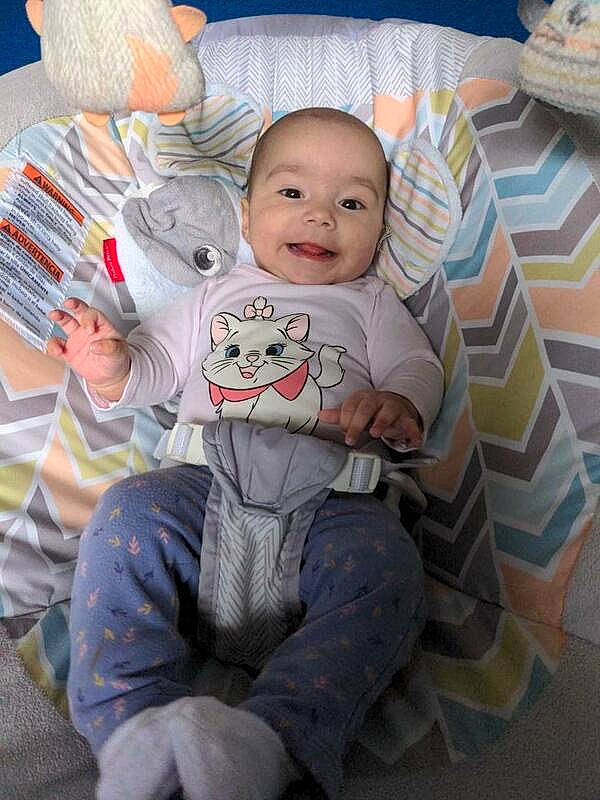 Amara joined the competition — help win amazing prizes! baby, baby_products, baby_toddler_clothing, bedding, child, comfort, flooring, fun, happy, joy, lap, linens, pattern, person, pillow, play, room, sitting, sleeve, smile