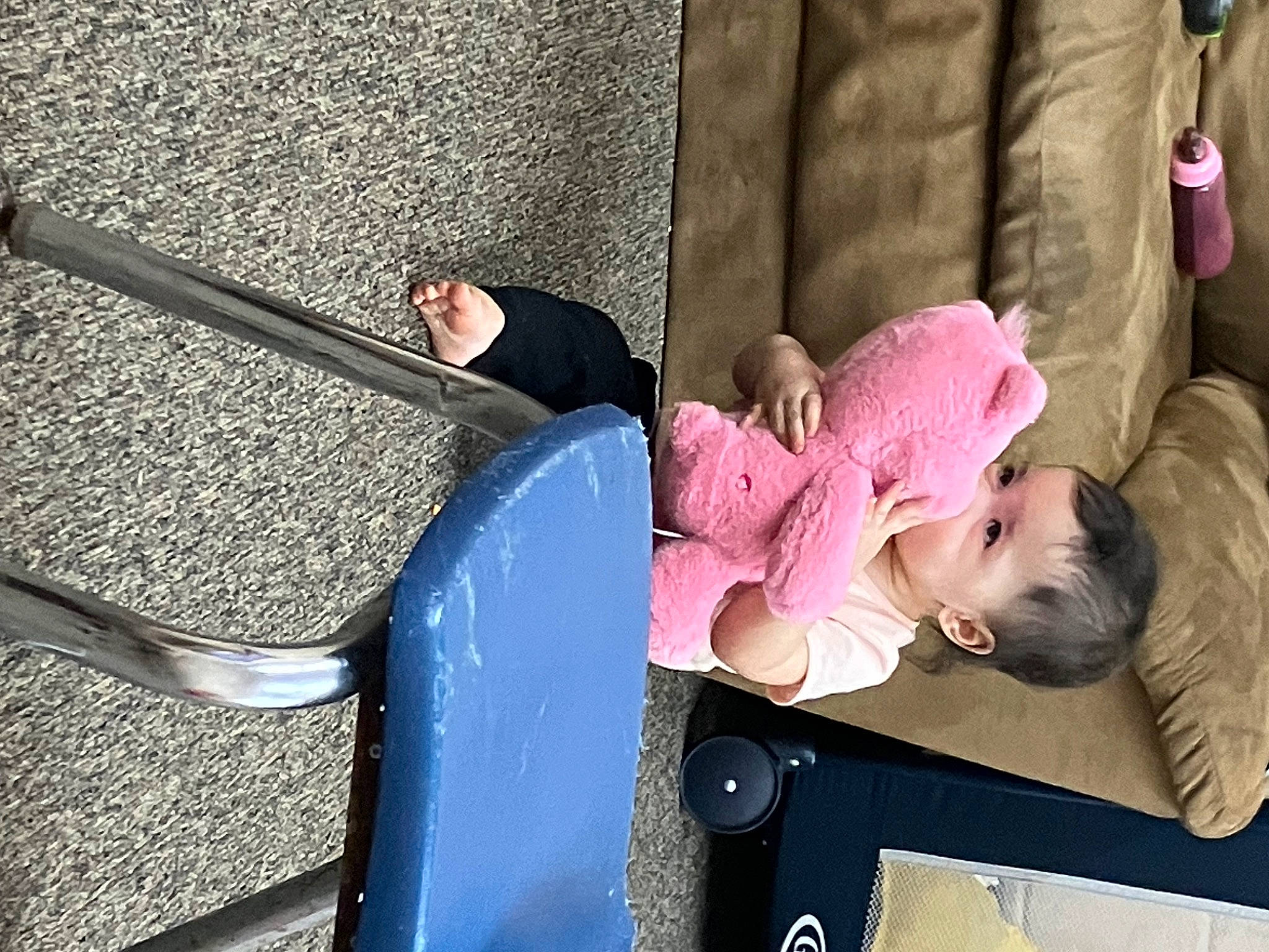 Arianna is registered to the contest to win money with this photo: asphalt, baby, baby_products, baggage, child, city, comfort, concrete, face, fun, leg, leisure, magenta, person, recreation, road_surface, sidewalk, sitting, toddler, travel