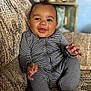 Psalm joined the competition — help win amazing prizes! baby, child, smiling, onesie, striped_clothing, couch, indoor, happy, infant, person, portrait, seated, cozy, home, furniture, hands, cute, face, expression, young