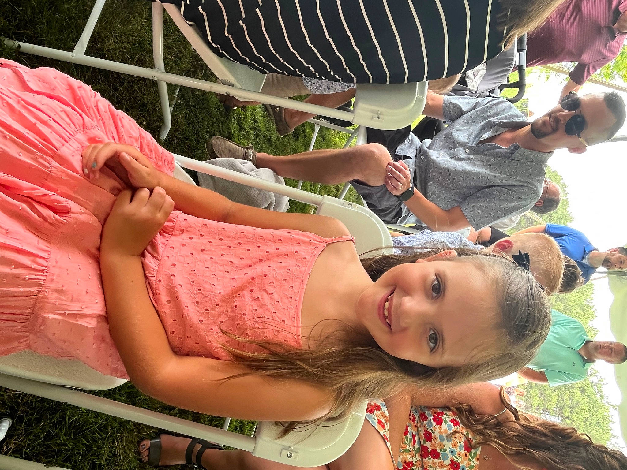 Julianna is registered to the contest to win money with this photo: event, eyewear, flesh, fun, grass, green, happy, hat, joy, leisure, person, recreation, shorts, sitting, spring, summer, thigh, vacation