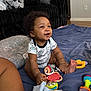 Princeton joined the competition — help win amazing prizes! baby, smiling, sitting, toys, blanket, indoors, couch, pillow, happy, child, infant, clothing, floor, foot, hand, colorful, portrait, cute, relaxed, playtime
