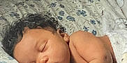 Princeton joined the competition — help win amazing prizes! baby, sleeping, curly_hair, blanket, pillow, bed, indoor, peaceful, infant, child, rest, soft_light, cozy, toddler, skin, head, hand, face, portrait, closeup
