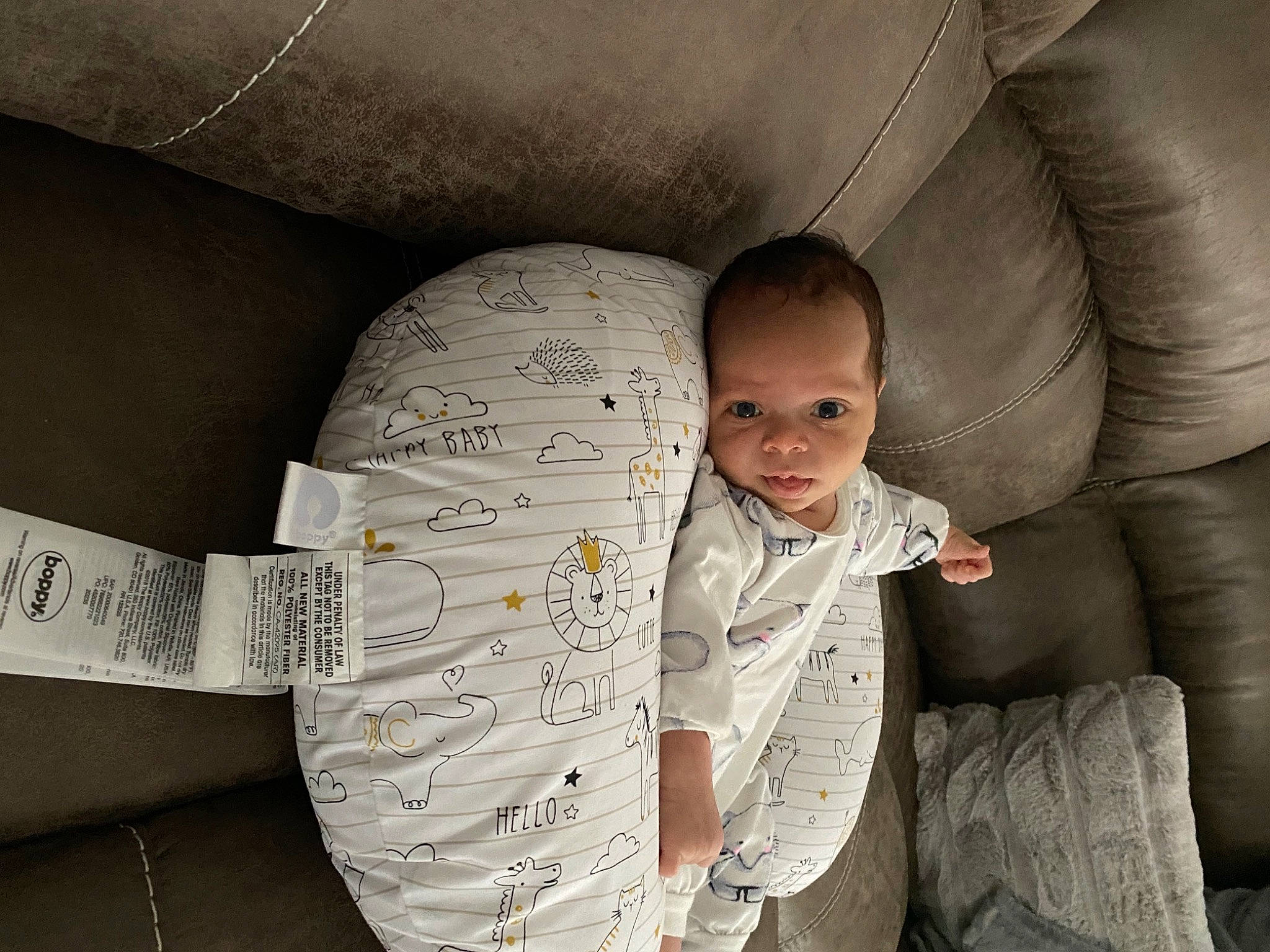 Izaiah is registered to the contest to win money with this photo: arm, baby, bedding, child, comfort, cool, couch, finger, flash_photography, fun, happy, human_body, linens, monochrome, monochrome_photography, mouth, pattern, room, sitting, toddler