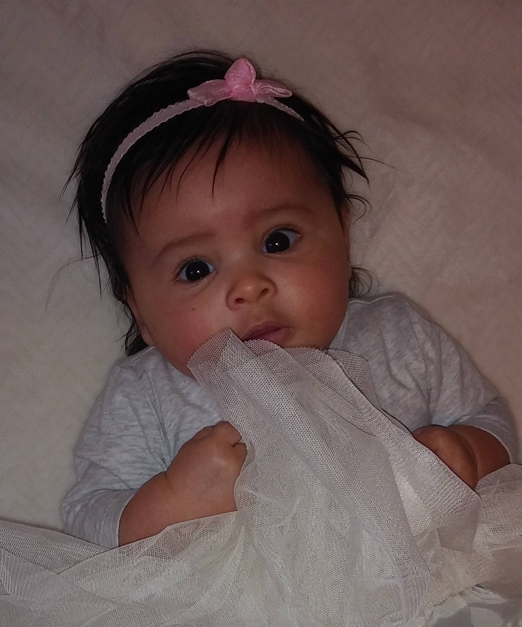 Annalia is registered to the contest to win money with this photo: baby, beauty, cheek, child, chin, eye, face, forehead, hair_accessory, hand, head, headgear, iris, lip, mouth, nose, person, pink, product, skin