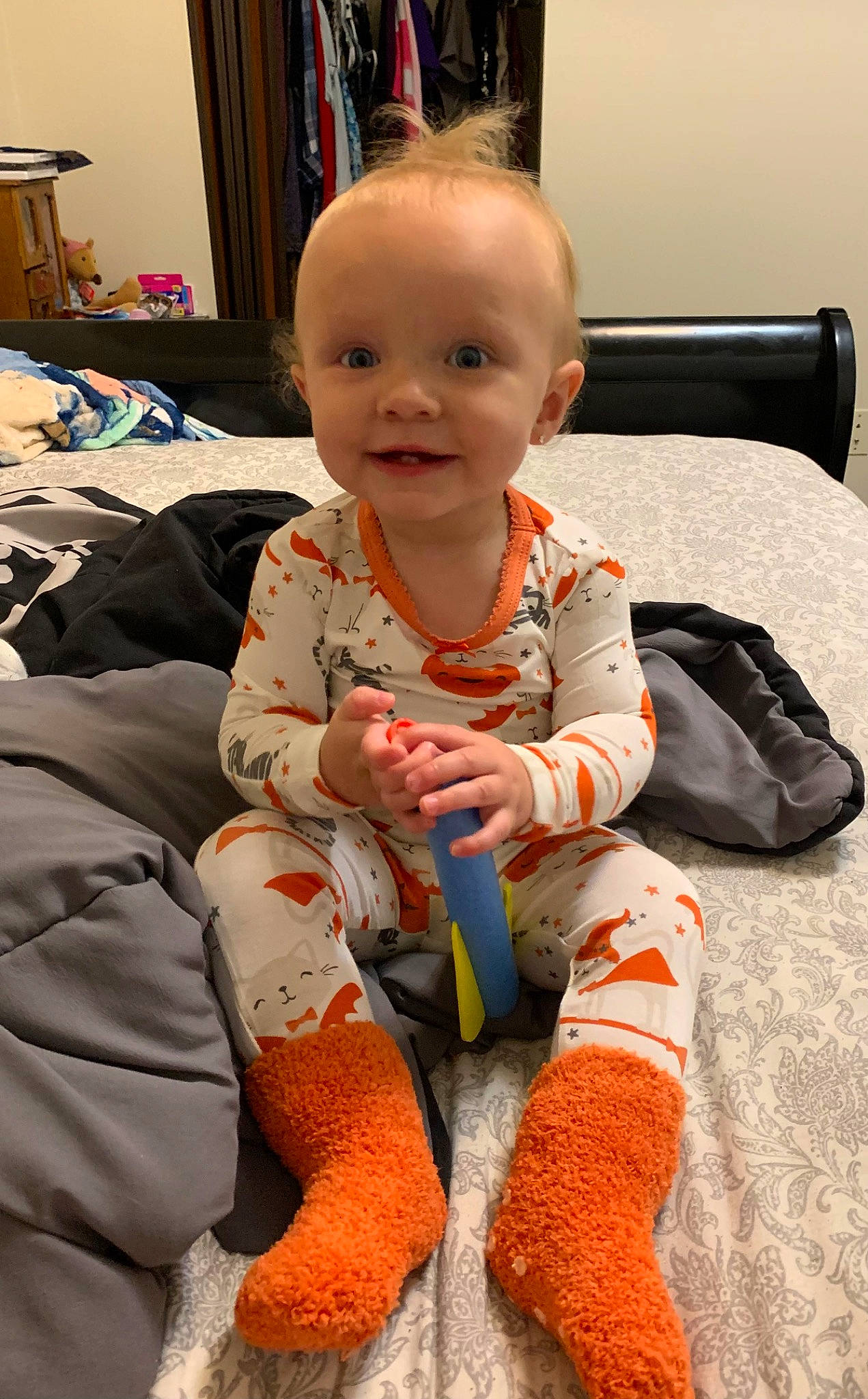 Tara is registered to the contest to win money with this photo: arm, baby, baby_toddler_clothing, carmine, cheek, child, comfort, flooring, foot, fun, head, human_leg, joy, knee, lap, person, room, sitting, skin, smile