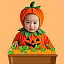 Mateo joined the competition — help win amazing prizes! baby, pumpkin_costume, halloween, orange, green_leaves, basket, pumpkin, cute, child, portrait, smiling, holiday, festive, costume, infant, background, studio, happy, plant, vines