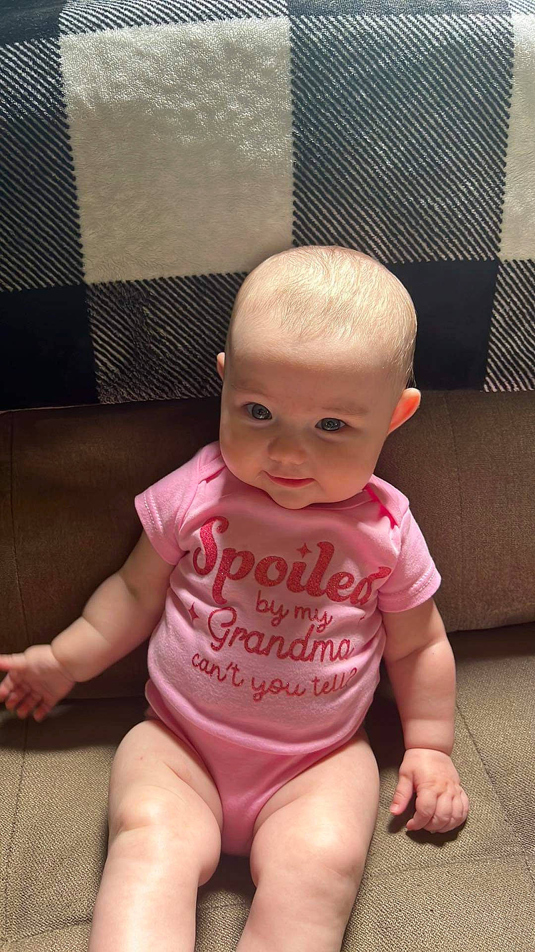 Aubree joined the competition — help win amazing prizes! baby, baby_toddler_clothing, cheek, chest, child, chin, comfort, eye, flooring, foot, human_leg, iris, knee, person, pink, sitting, skin, sleeve, stomach, thigh