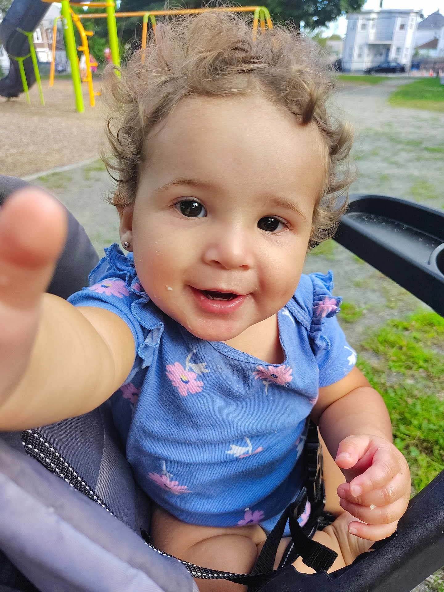 Soliany joined the competition — help win amazing prizes! baby, blue_dress, child, curly_hair, cute, daylight, grass, happy, nature, outdoor, park, person, playground, reaching_hand, seat, smiling, stroller, summer, swing_set, toddler