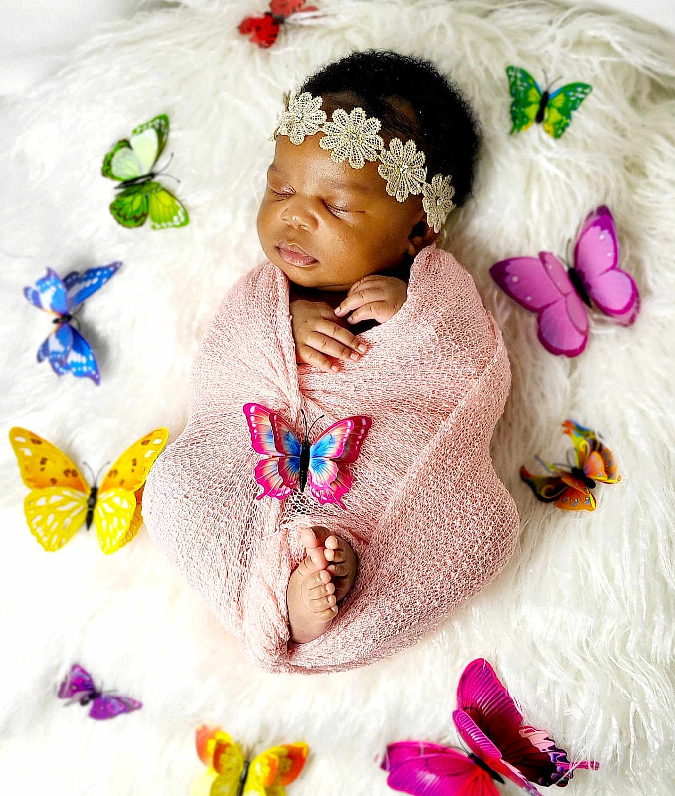 Alba joined the competition — help win amazing prizes! baby, sleeping, wrapped, pink_blanket, headband, flowers, butterflies, colorful, soft_texture, white_background, newborn, peaceful, hands, feet, portrait, infant, cozy, cute, decorative, lying_down