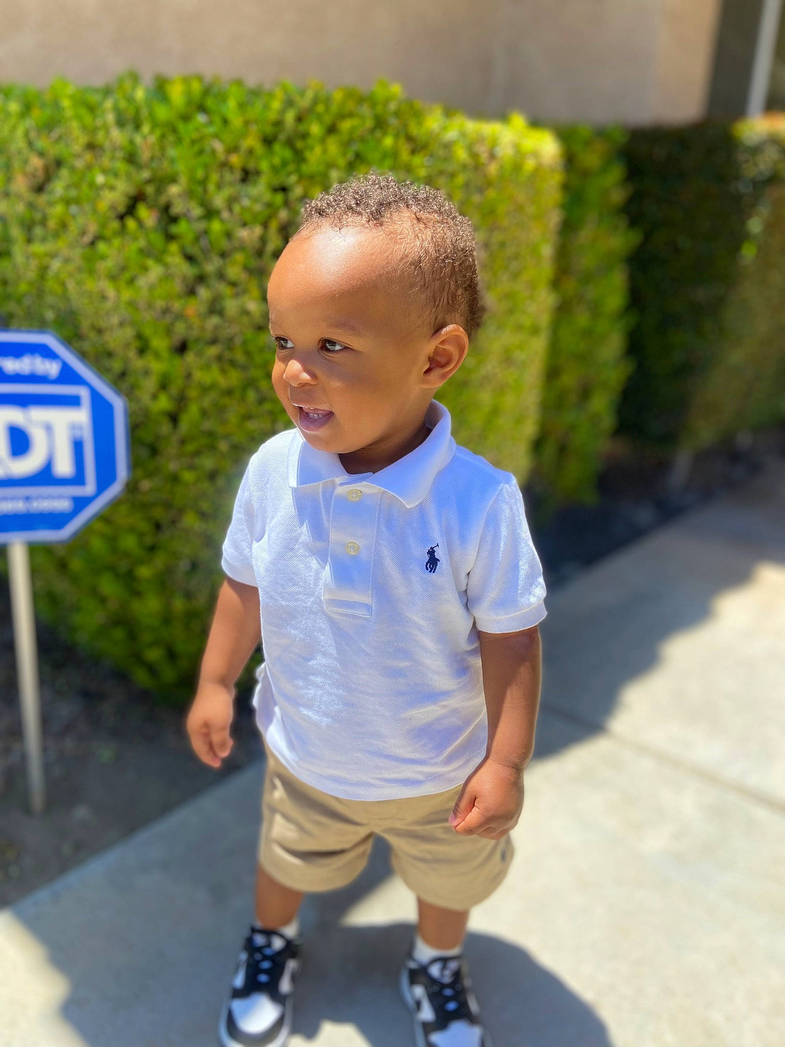 Jace joined the competition — help win amazing prizes! asphalt, child, electric_blue, fun, grass, happy, leisure, logo, pedestrian, person, plant, recreation, road, shorts, sign, smile, t_shirt, toddler, traffic_sign, tree