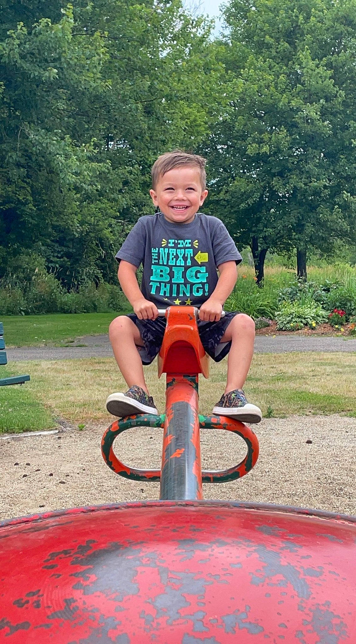 Bowen joined the competition — help win amazing prizes! baby_toddler_clothing, balance, bicycle_accessory, electric_blue, fun, gas, grass, happy, joy, leisure, outdoor_play_equipment, people_in_nature, person, plant, playground, recreation, shorts, smile, tire, toddler