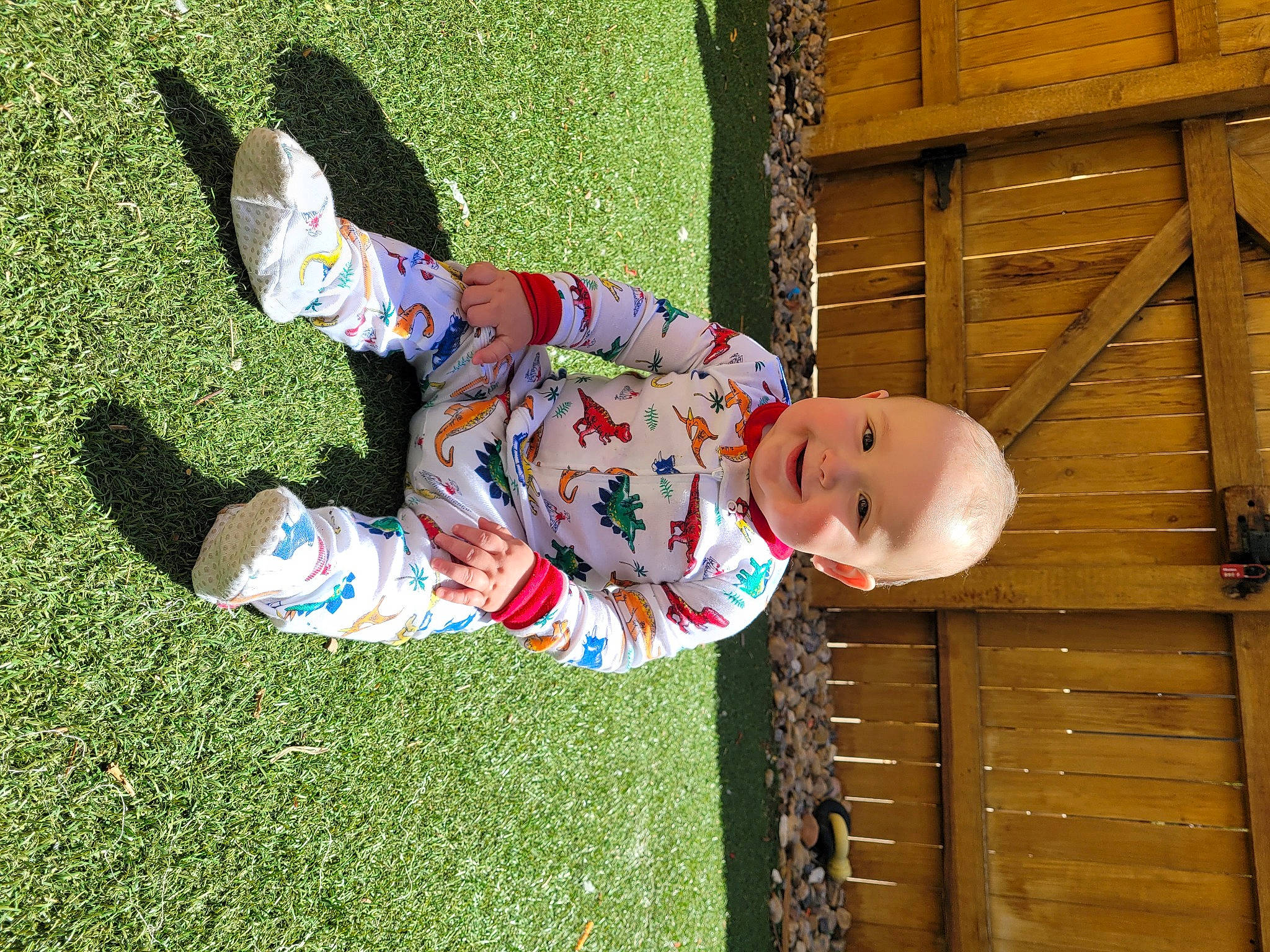 Darian is registered to the contest to win money with this photo: baby, baby_toddler_clothing, child, foot, fun, grass, happy, hat, human_body, joy, lawn, leisure, pattern, people_in_nature, person, plant, public_space, sitting, spring, toddler