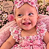 baby, baby_dress, blanket, bow, child, dress, face, floral, flowers, happy, headband, indoor, infant, little_princess, nursery, pink, portrait, roses, seated, smiling