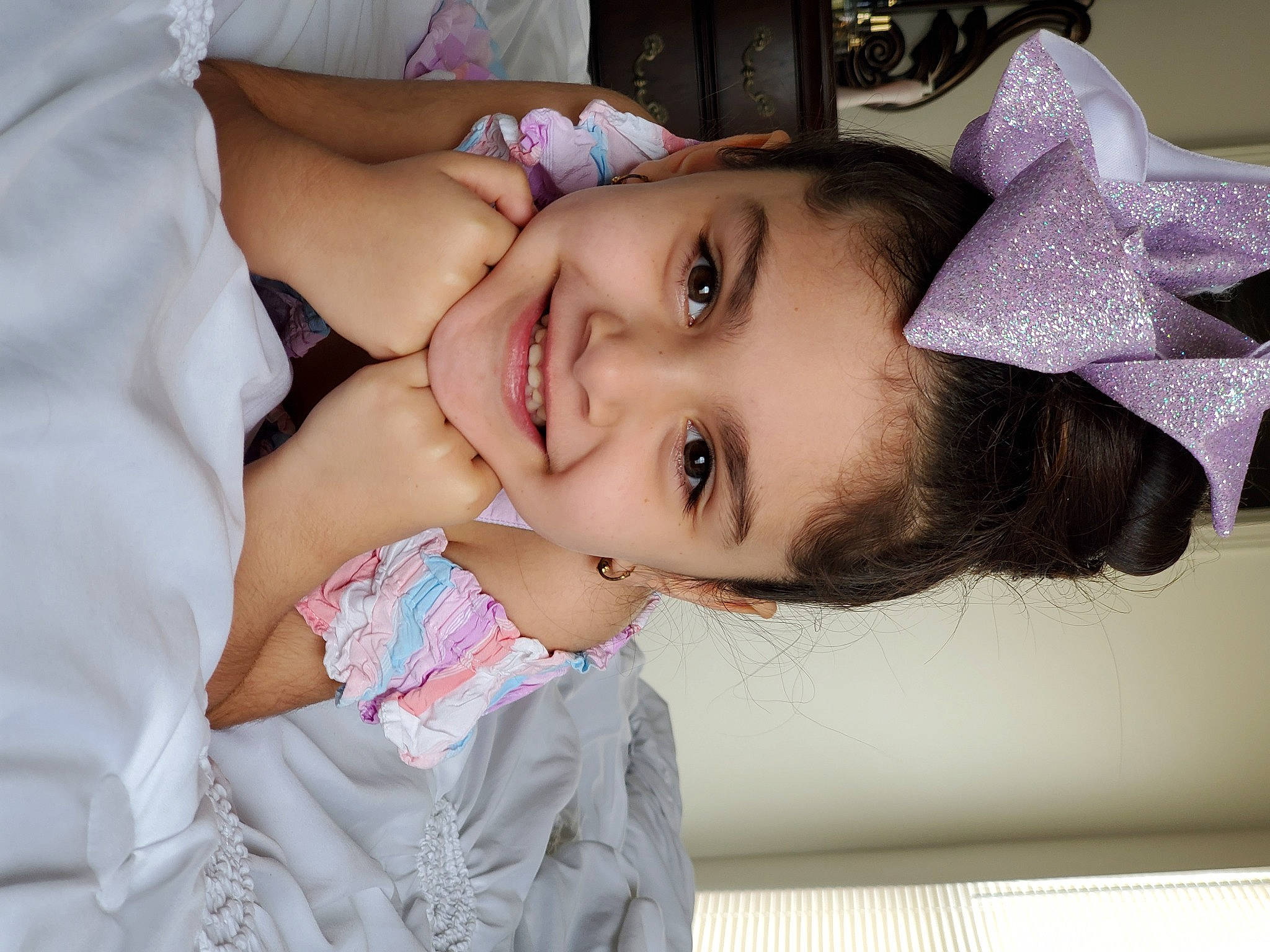 Celeste is registered to the contest to win money with this photo: baby, beauty, cheek, child, chin, eye, eyebrow, eyelash, face, forehead, hair_accessory, head, headgear, joy, lip, mouth, nose, person, pink, purple