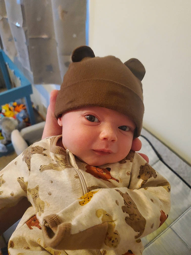 Benjamin joined the competition — help win amazing prizes! baby, baby_toddler_clothing, beanie, cap, cheek, child, comfort, eye, fashion_accessory, fun, fur, headgear, headwear, hoodie, jacket, knit_cap, person, sitting, sleeve, toddler
