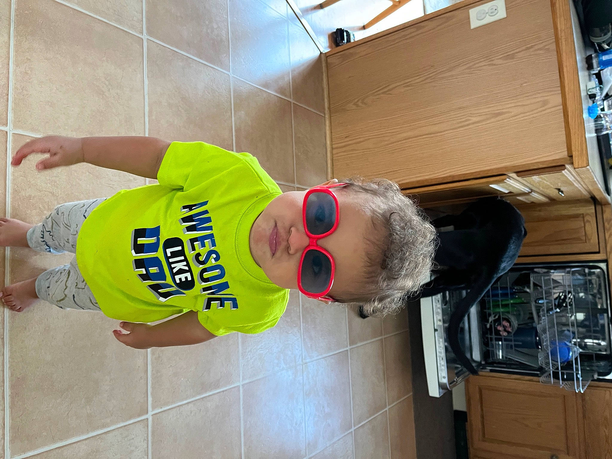 Grayson joined the competition — help win amazing prizes! baseball_cap, cabinetry, cap, child, cricket_cap, elbow, engineering, eyewear, flooring, fun, hat, machine, person, room, shorts, sneakers, sportswear, sunglasses, t_shirt, walking_shoe