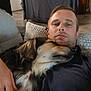 Leyka a rejoint le concours — aidez-le/la à gagner de superbes lots ! man, dog, couch, indoor, pet, relaxing, comfort, casual, home, furniture, closeup, portrait, resting, animal, friendship, cozy, laying, human, companion, living_room