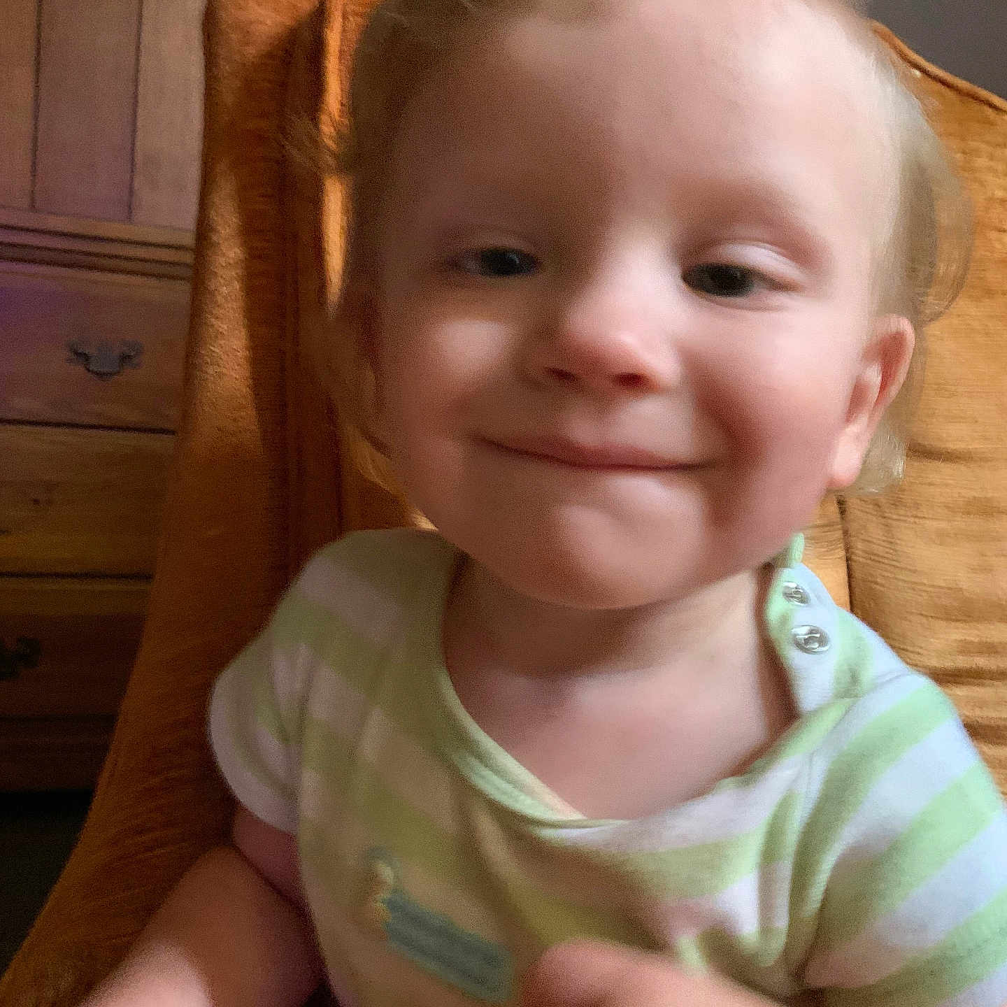 Caden joined the competition — help win amazing prizes! baby, bodypart, cabinet, chair, clothing, couch, face, finger, furniture, hand, happy, head, homedecor, laughing, person, photography, portrait, smile, t_shirt, wood