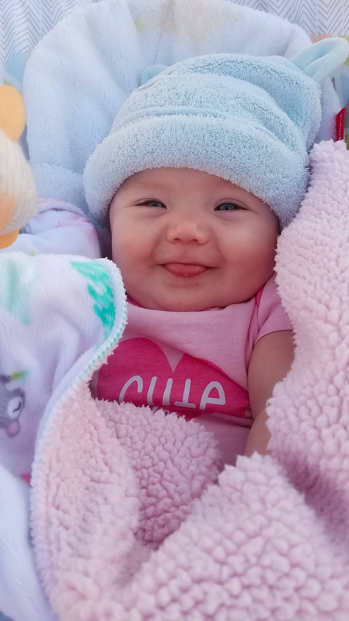 Harlie is registered to the contest to win money with this photo: baby, beauty, bonnet, cheek, child, eye, face, happy, head, headgear, joy, knit_cap, lip, person, pink, skin, smile, textile, toddler, wool
