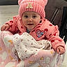 Alice participe au concours pour gagner de l'argent avec cette photo : baby, blanket, cheeks, cozy, cute, fabric_pattern, hand, heart_pattern, infant, knit_hat, pacifier_clip, pink_hat, pink_jacket, pom_poms, portrait, smiling, soft_blanket, stroller, wide_eyes, winter_clothes