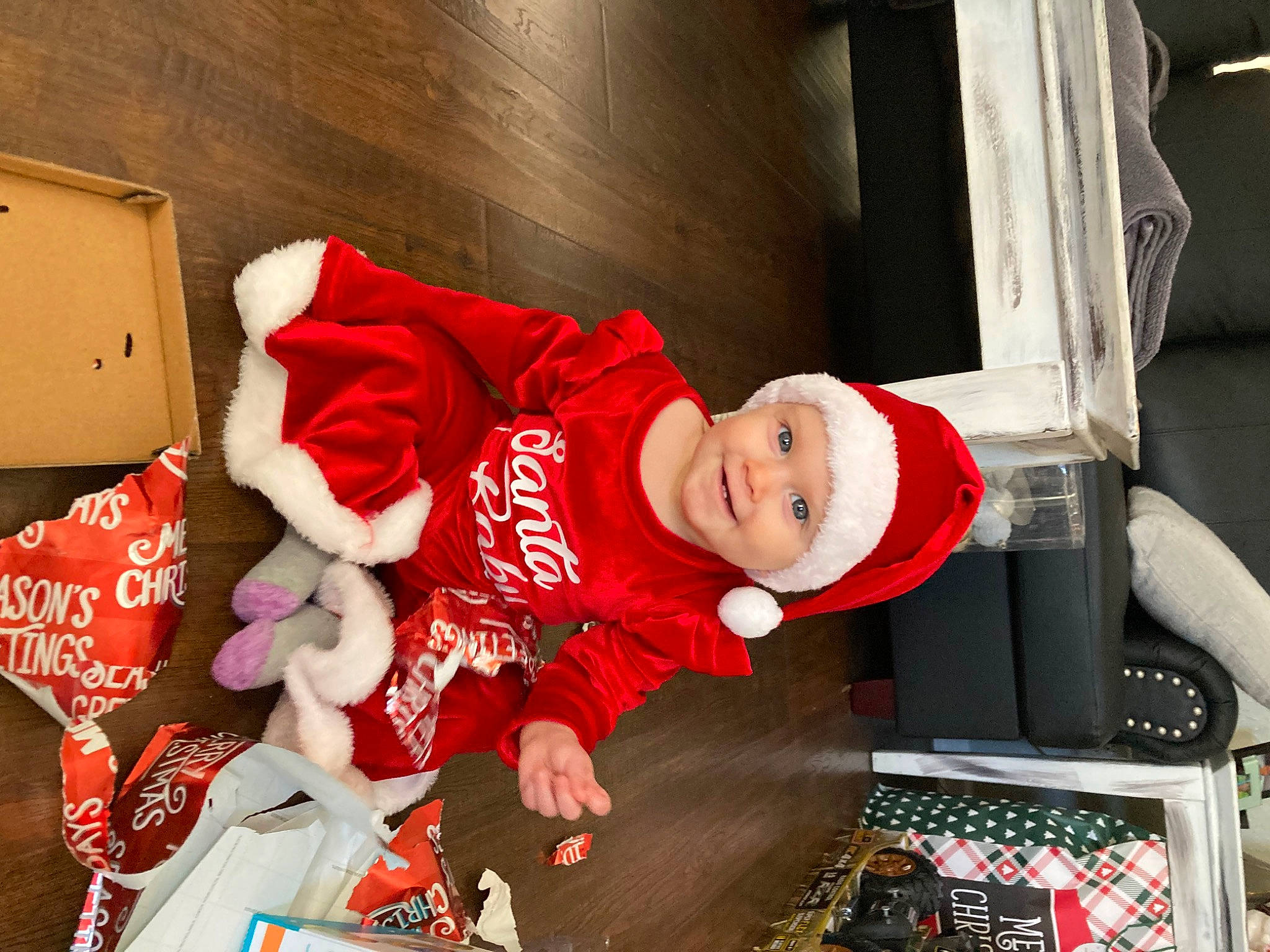 Mariana joined the competition — help win amazing prizes! baby, baby_toddler_clothing, carmine, child, christmas, christmas_eve, costume, event, fictional_character, fun, happy, hat, headwear, holiday, joy, lap, person, room, sitting, smile