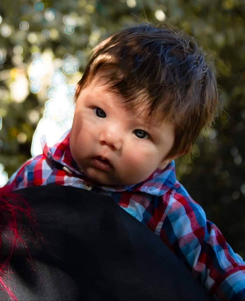 Fynn is registered to the contest to win money with this photo: baby, cheek, child, child_model, design, eye, face, hair, male, outerwear, pattern, person, plaid, portrait_photography, toddler