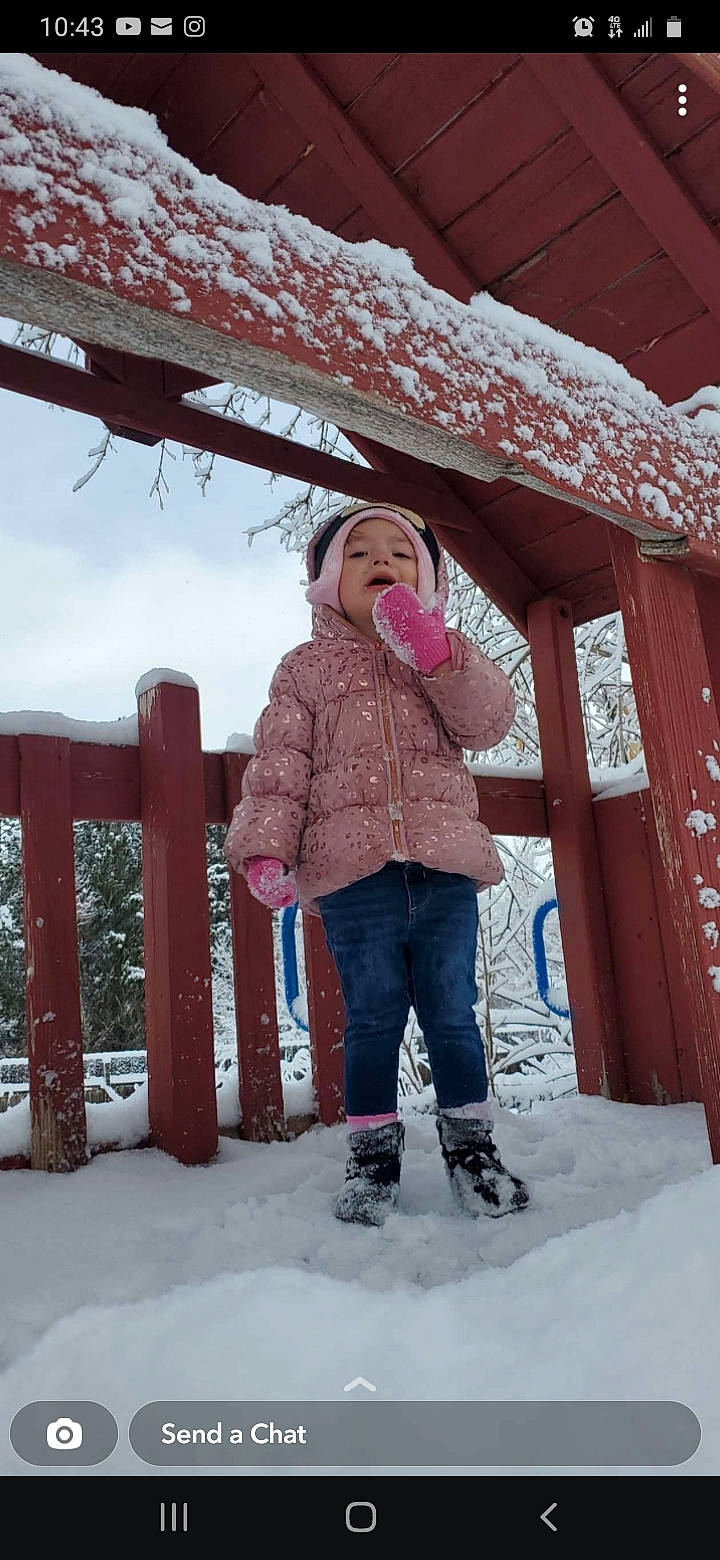 Ezralina is registered to the contest to win money with this photo: child, denim, freezing, fun, headwear, jacket, leisure, magenta, person, pink, precipitation, recreation, sky, snow, standing, street_fashion, textile, toddler, tree, vacation