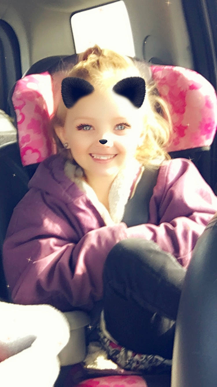 Sterling joined the competition — help win amazing prizes! car_seat, comfort, cool, eye, finger, fun, gesture, happy, human_body, iris, joy, lip, long_hair, magenta, mouth, person, pink, purple, selfie, sitting