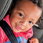 Dallas joined the competition — help win amazing prizes! baby, car_seat, child, closeup, clothing, curly_hair, cute, face, happy, indoors, kid, person, portrait, red_hoodie, safety, seatbelt, smile, spiderman, toddler, young_child