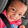 baby, car_seat, child, closeup, clothing, curly_hair, cute, face, happy, indoors, kid, person, portrait, red_hoodie, safety, seatbelt, smile, spiderman, toddler, young_child