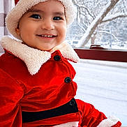 Liam joined the competition — help win amazing prizes! toddler, child, smiling, santa_hat, red_clothing, winter, snow, window, holiday, festive, cute, portrait, indoor, seasonal, happy, baby, fur_trim, buttoned_jacket, face, black_eyes