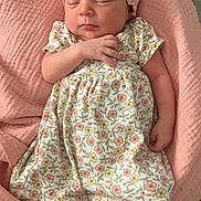 Olivia is registered to the contest to win money with this photo: baby, newborn, sleeping, pink, headband, bow, floral_dress, blanket, infant, cute, peaceful, soft, tiny_toes, resting, child, portrait, indoors, cozy, closeup, adorable