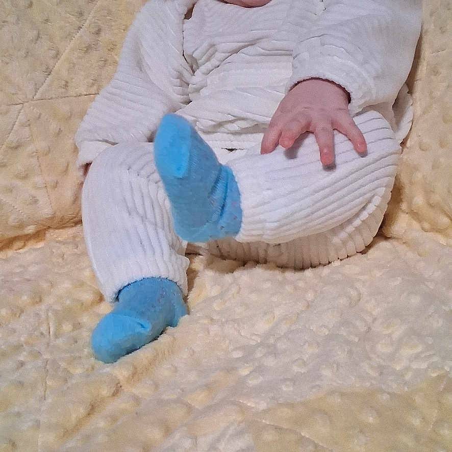 Haidyn joined the competition — help win amazing prizes! baby, infant, smiling, blue_headband, blue_socks, white_outfit, blanket, soft_texture, sitting, happy, cute, child, portrait, indoors, cozy, warm, comfortable, playful, small_hand, headband