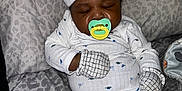 Deomari is registered to the contest to win money with this photo: baby, sleeping, pajamas, mittens, hat, pacifier, blanket, infant, cute, cozy, resting, child, patterned, soft, comfort, portrait, indoors, peaceful, relaxed, sleep